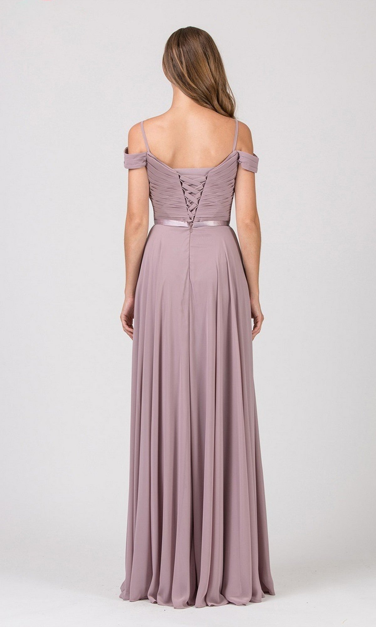 A woman faces away from the camera, wearing the Eureka 7611 long prom dress—a mauve, off-the-shoulder chiffon gown with a ruched fitted bodice and lace-up open back—set against a plain light background.